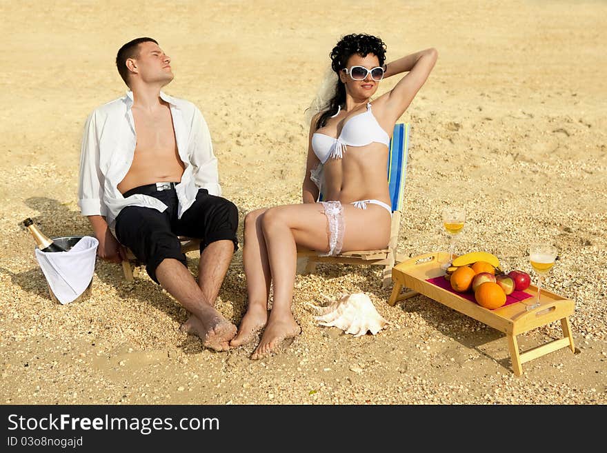 Couple resting on the beach