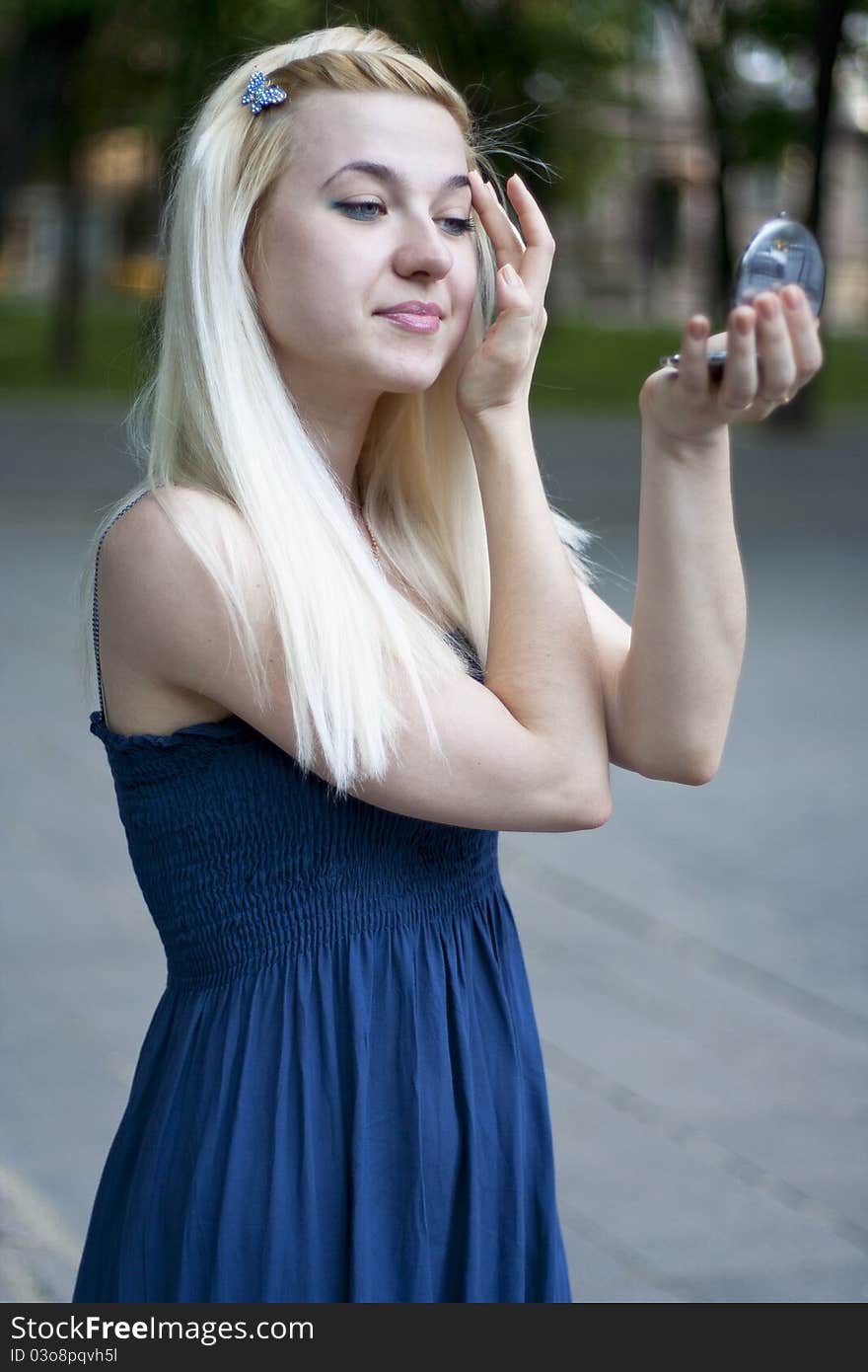 Portrait of young woman in small mirror. Portrait of young woman in small mirror