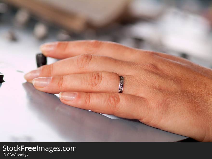 Woman's hands on the remote control in an industrial plant