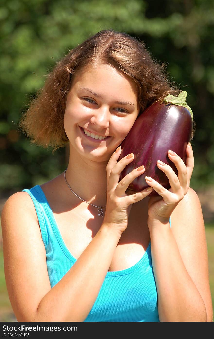 Girl holding a aubergine