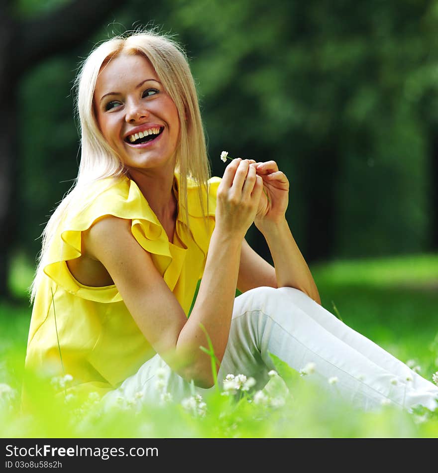 Woman dachshund in her arms on grass