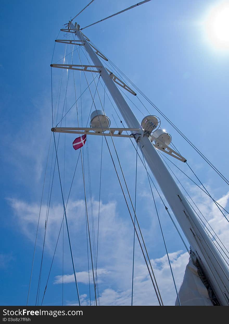 Sails and mast with radar of a modern sail boat boating sailing background. Sails and mast with radar of a modern sail boat boating sailing background