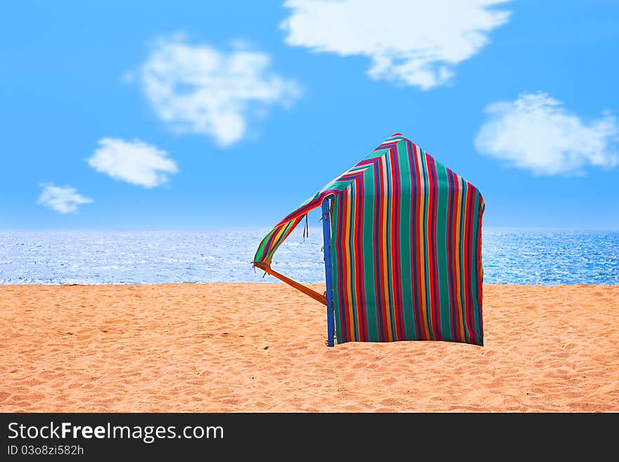 Colored hut on a deserted beach