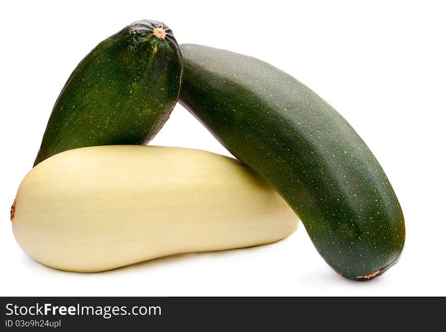 Three ripe zucchini on a white background. Three ripe zucchini on a white background