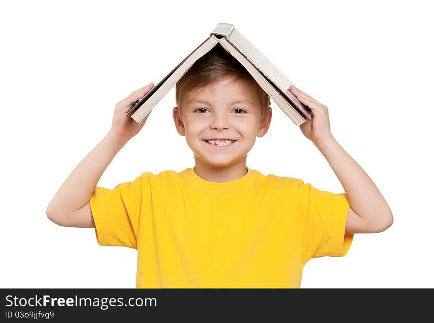 Portrait of little schoolboy with book on white background. Portrait of little schoolboy with book on white background