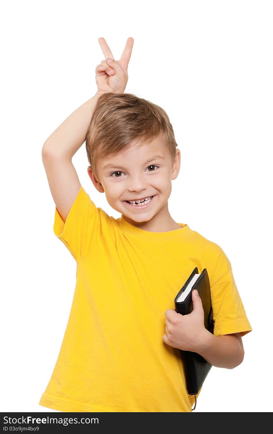 Portrait of little schoolboy holding book on white background. Portrait of little schoolboy holding book on white background