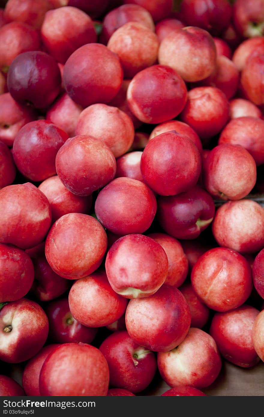 Well layed nectarines in a supermarket or on a fruit stand at market. Stock photo details