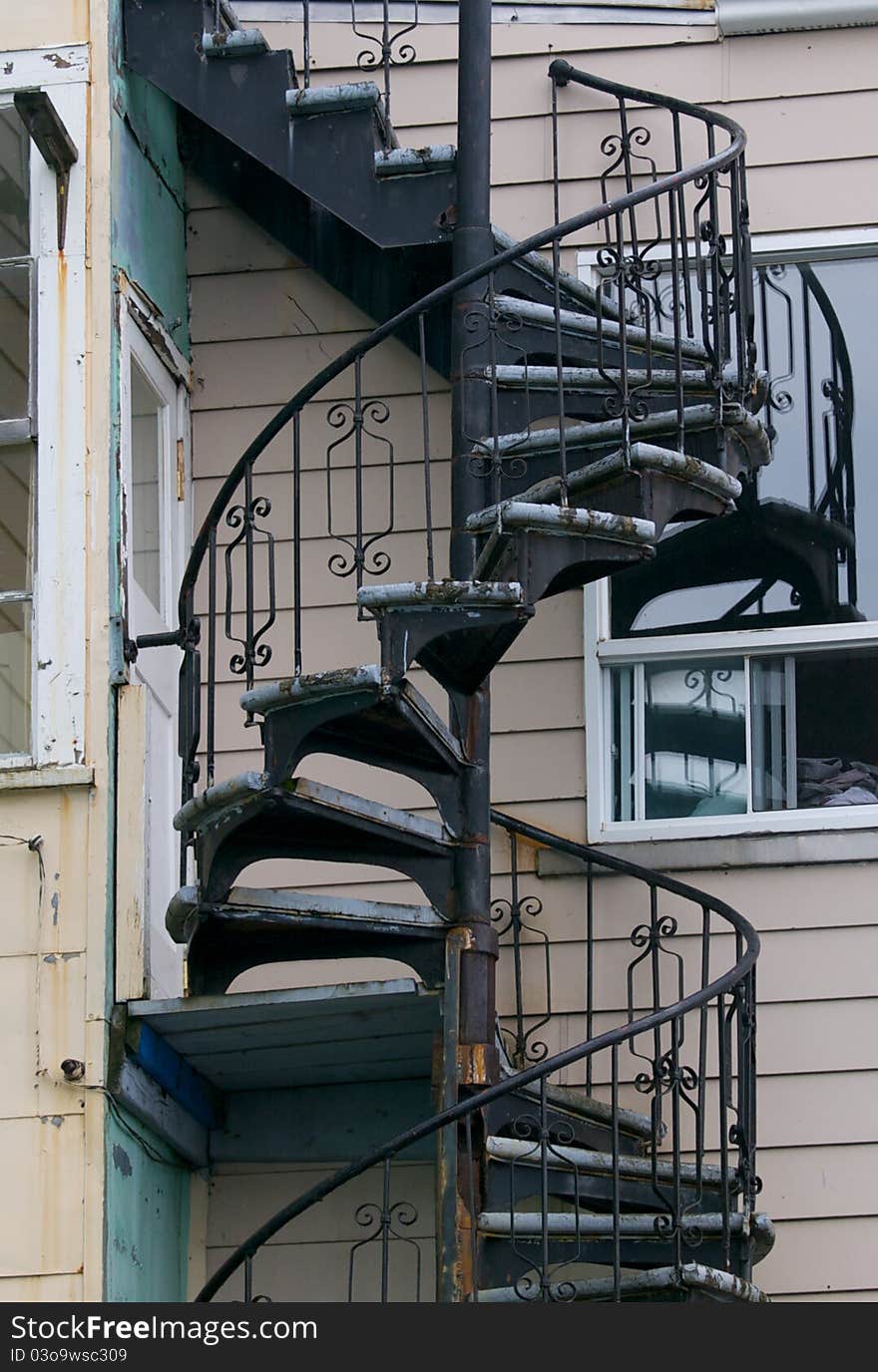 Outdoor weathered spiral wooden staircase. Outdoor weathered spiral wooden staircase