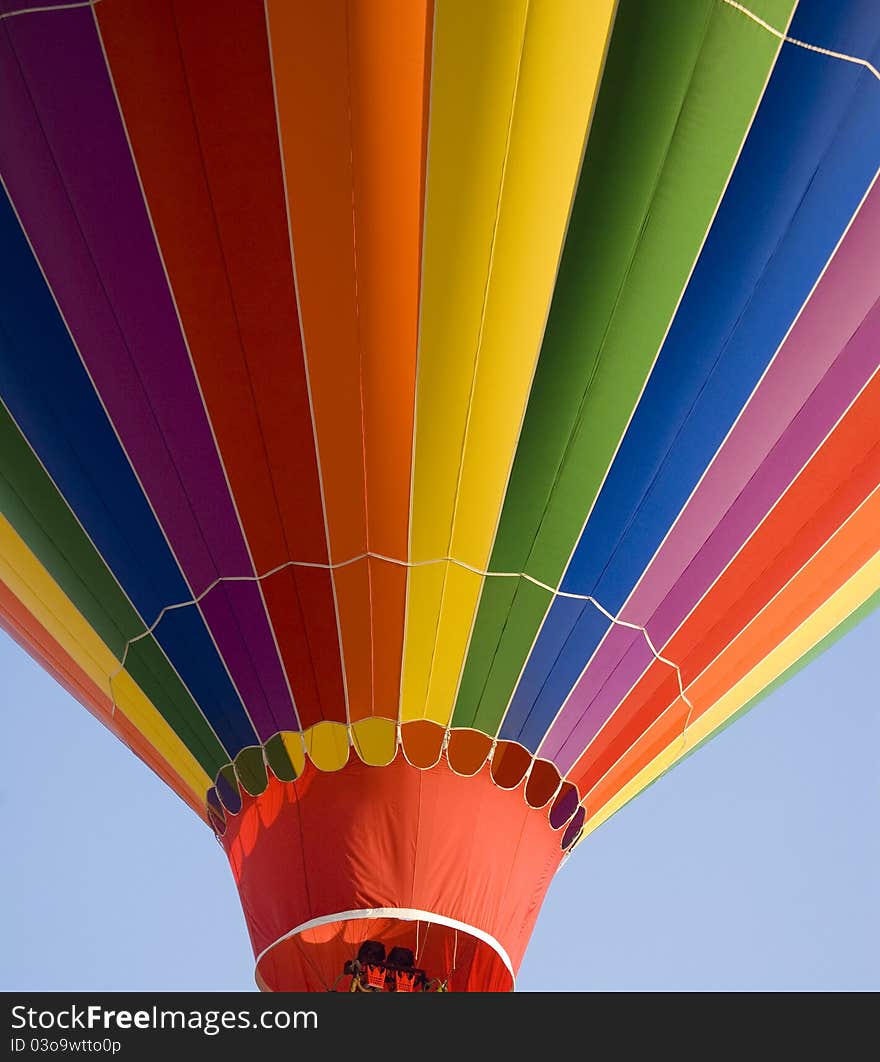 Colorful Hot Air Balloon Ascending into the summer sky. Colorful Hot Air Balloon Ascending into the summer sky