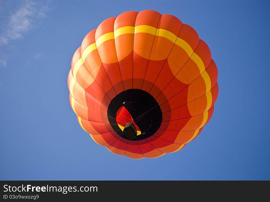 Colorful Hot Air Balloon Ascending into the summer sky. Colorful Hot Air Balloon Ascending into the summer sky