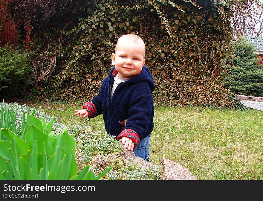 The Kid Playing In The Garden