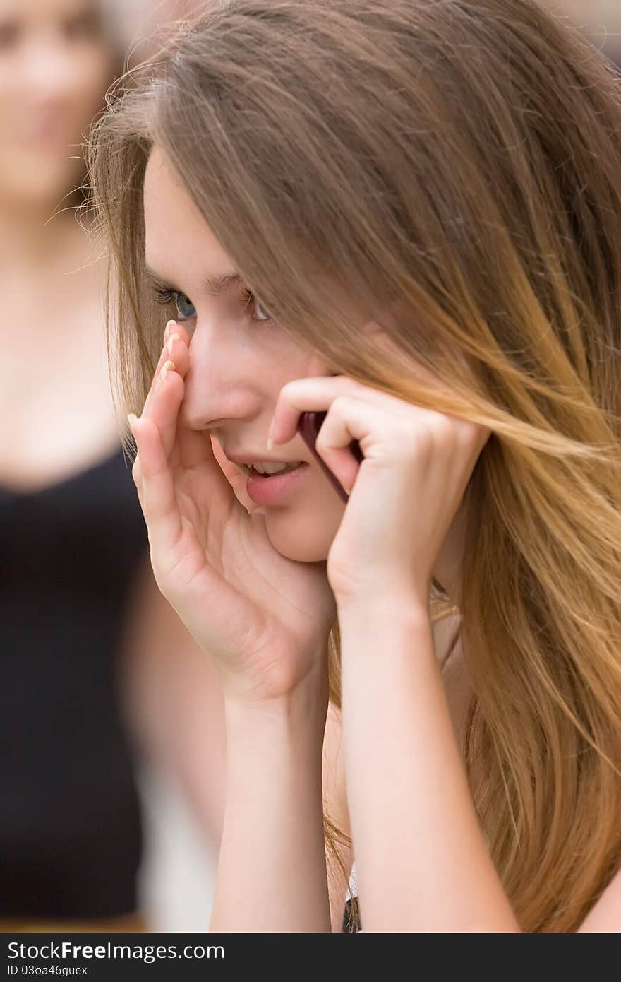 Portrait of attractive girl that is trying to talk via phone on noisy street. Portrait of attractive girl that is trying to talk via phone on noisy street