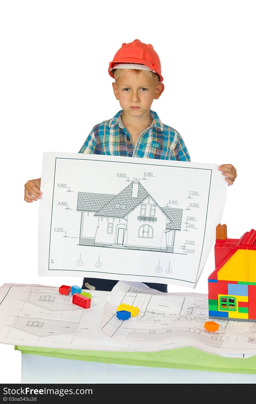 Little boy in orange helmet holding house drawing. Little boy in orange helmet holding house drawing