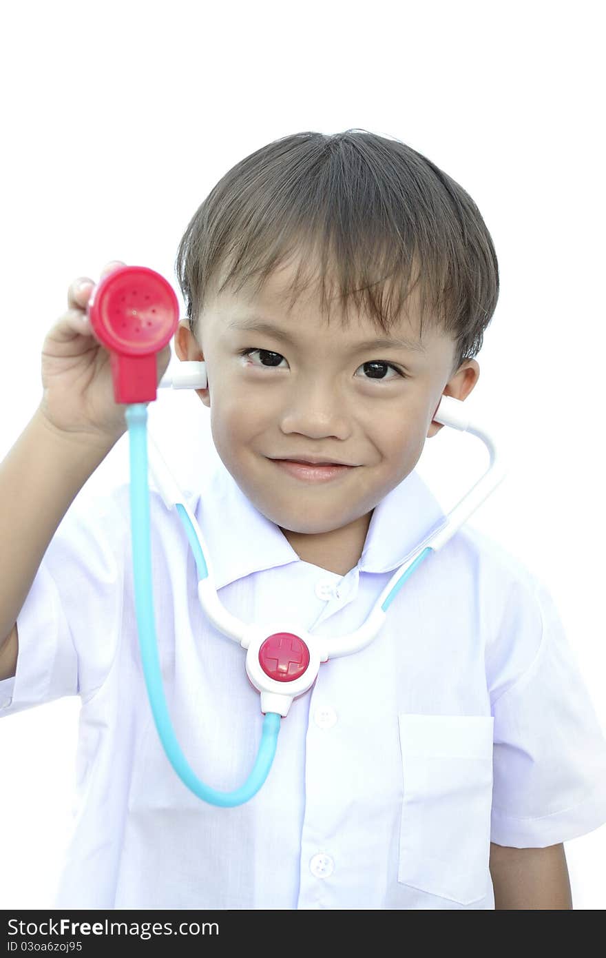 Young asian boy in doctor uniform on white background.