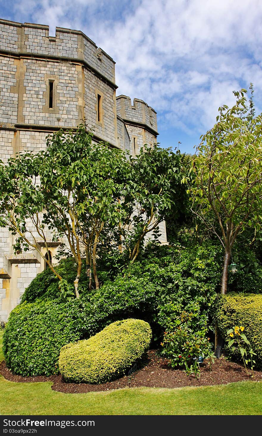 Eastern side of Royal Windsor Castle in England with formal garden area. Eastern side of Royal Windsor Castle in England with formal garden area