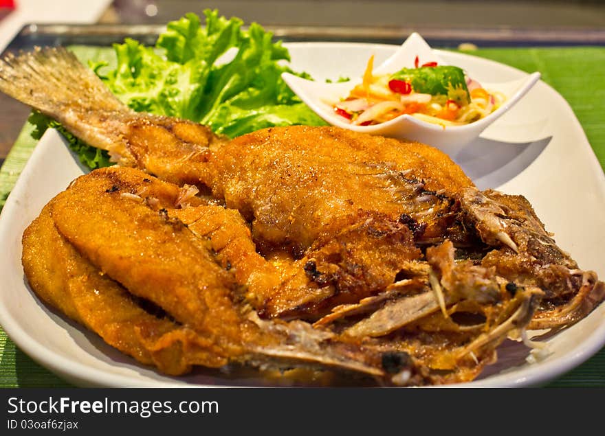 Fried snapper with mango salad. Fried snapper with mango salad