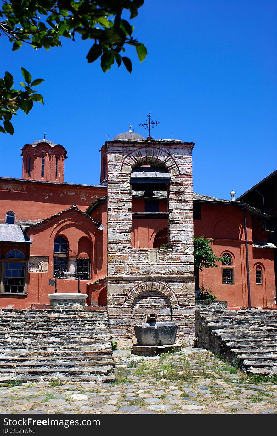 Red belfry stone tower in Mount Athos