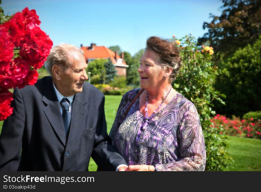 Old Couple In Garden