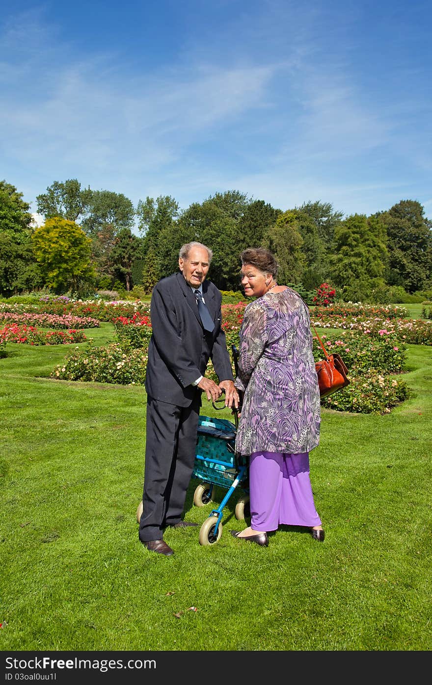 Garden walking of old couple. Garden walking of old couple