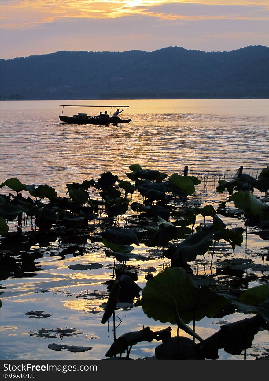 Fishing boat in Hangzhou West Lake, China. Fishing boat in Hangzhou West Lake, China