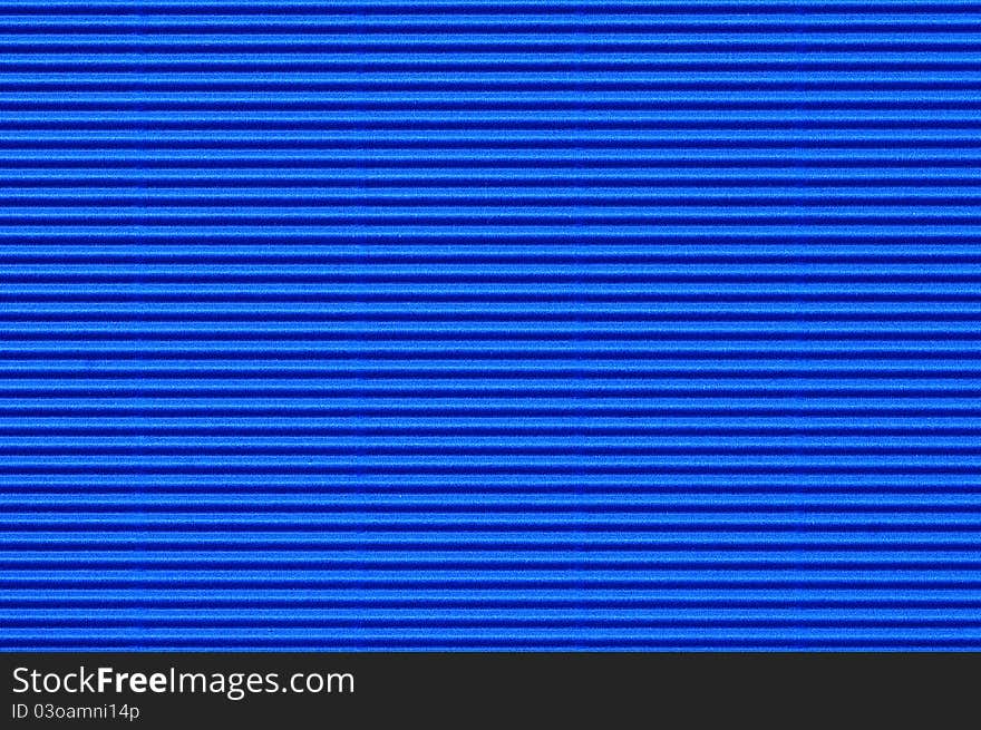 Seamless texture of blue corrugate cardboard