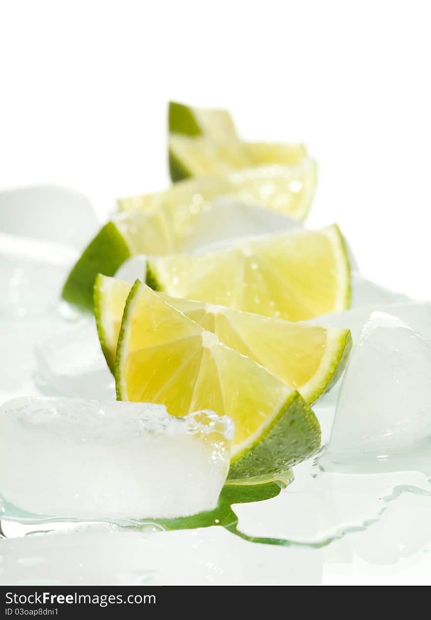 Closeup ofLemon slices on ice isolated on white Background.