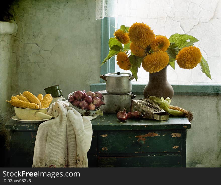 Bouquet of sunflowers, corn and bow on a table