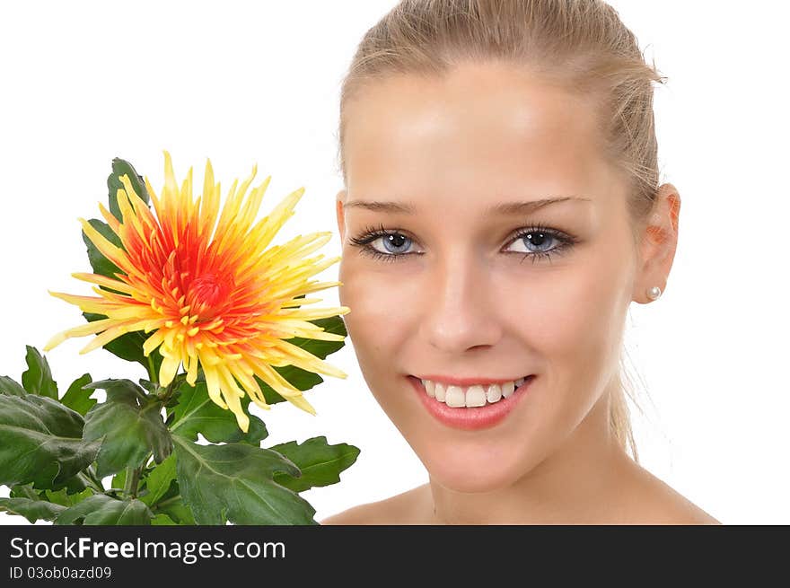 Smiling woman shows a flower