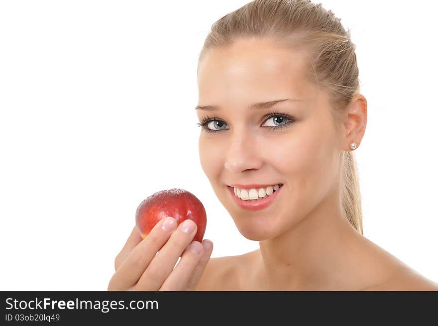 young woman holding a red nectarine. young woman holding a red nectarine