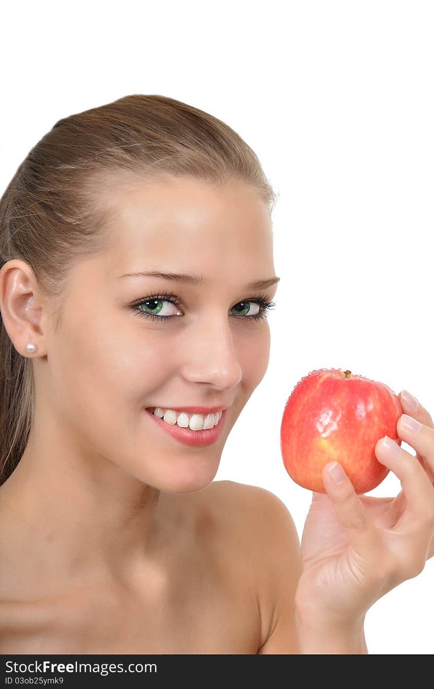 Sexy young woman with green eyes holding an apple