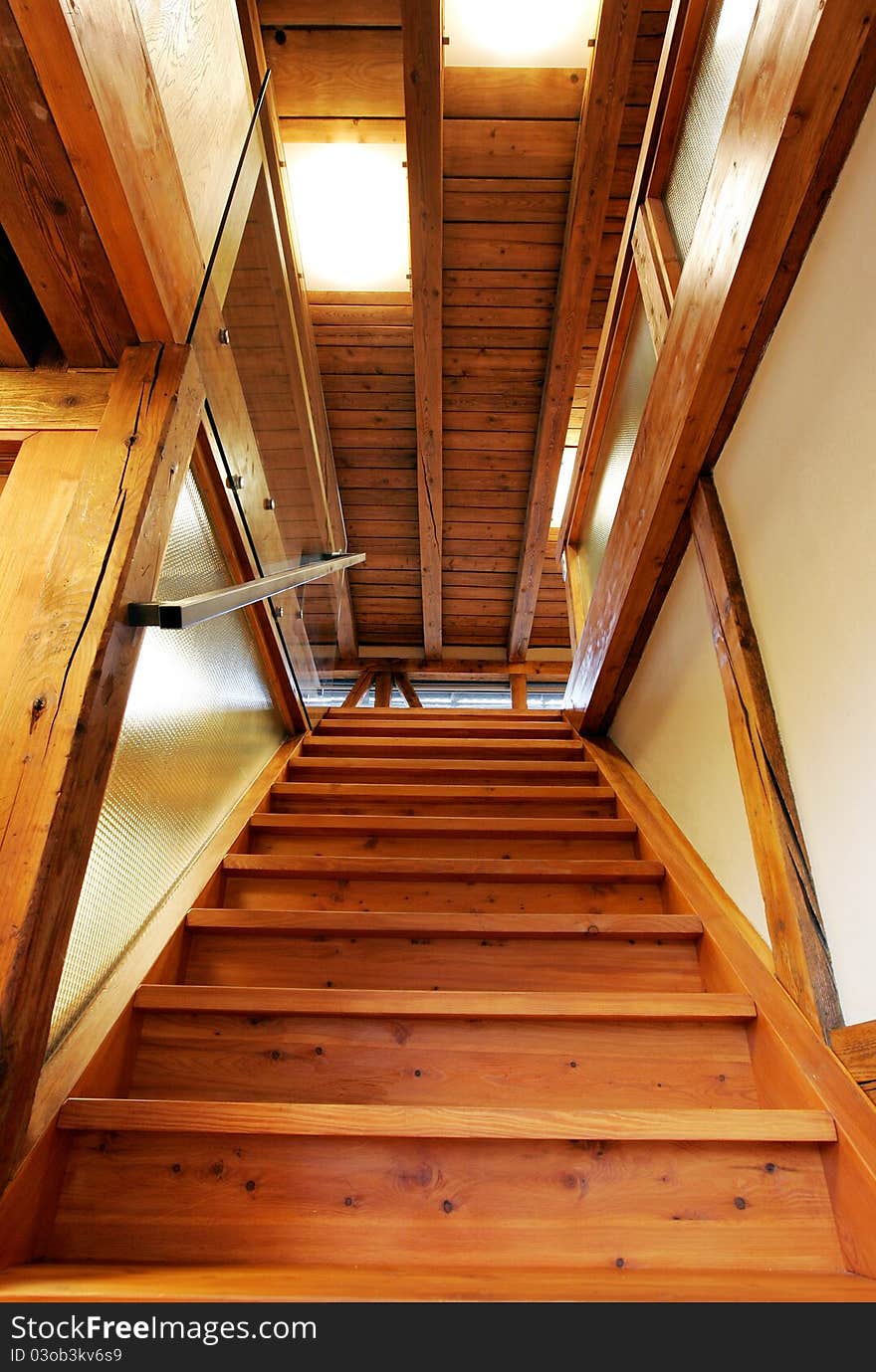 New wooden stairs in bright interior