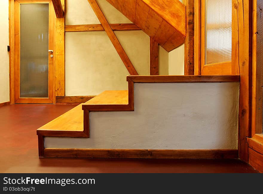 New wooden stairs in bright interior