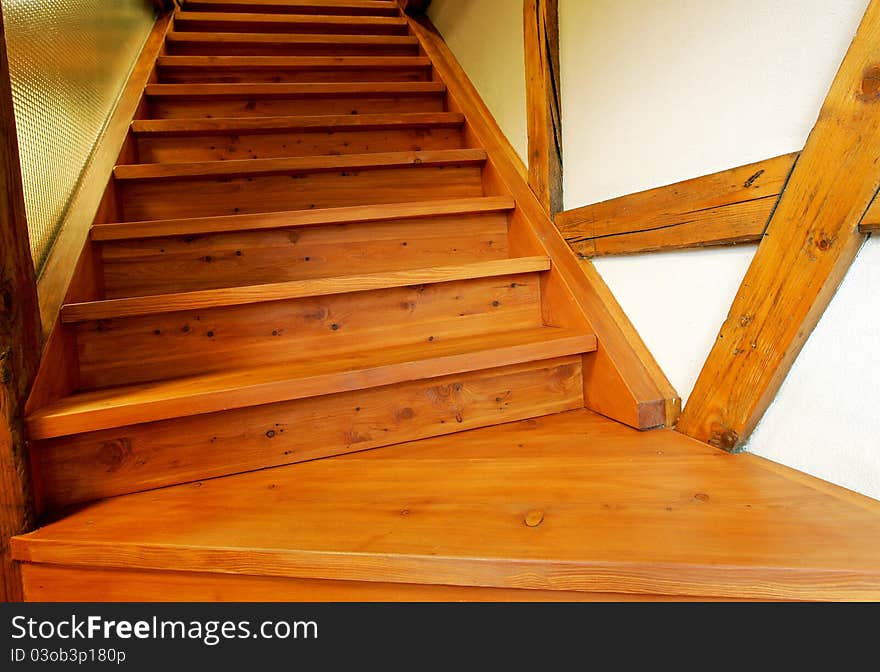 New wooden stairs in bright interior