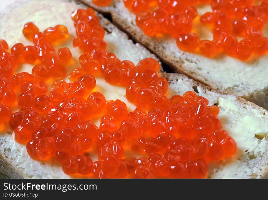 Close-up of red caviar with bread and butter