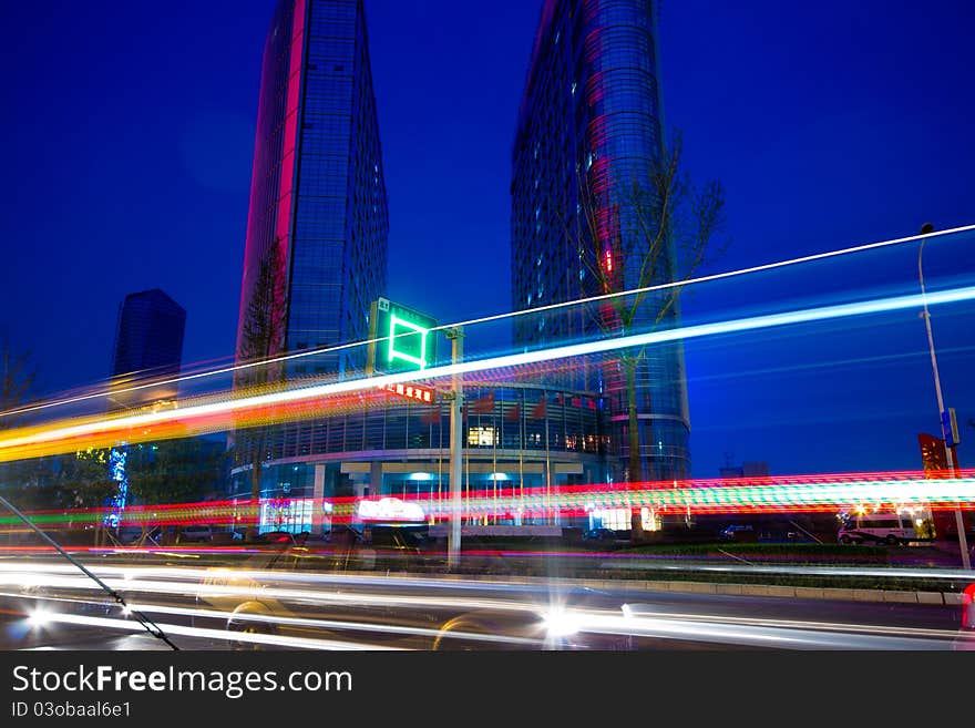 The light trails on the modern building background in shanghai china.