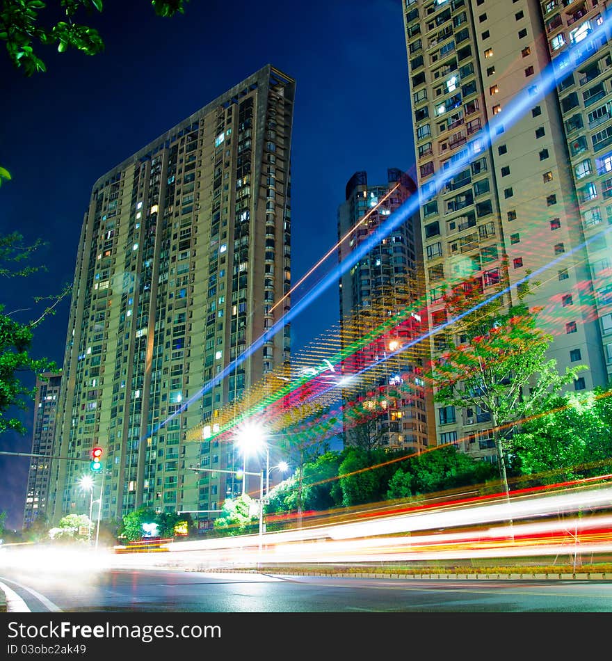 The light trails on the modern building background in shanghai china.