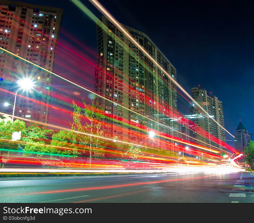 The light trails on the modern building background in shanghai china.