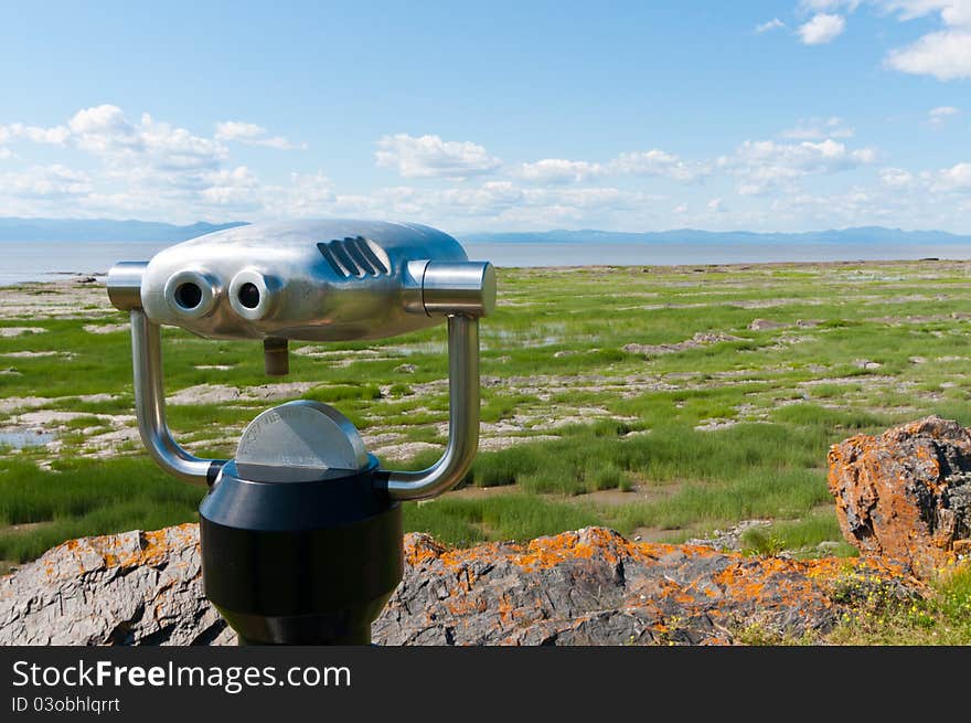 Sightseing large binocular looking at the horizon. Sightseing large binocular looking at the horizon