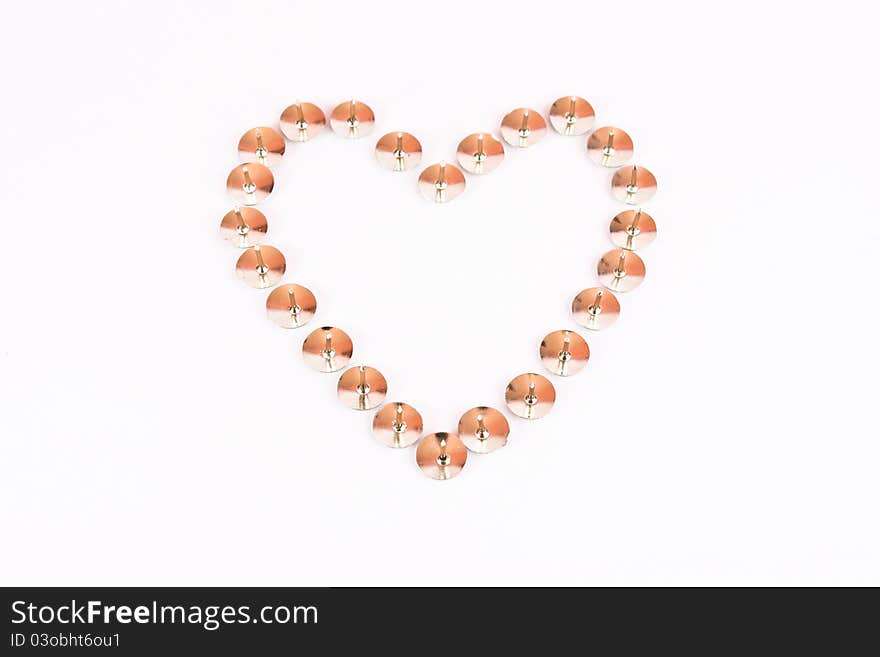 Heart made of thumbtack fake on white background. Heart made of thumbtack fake on white background