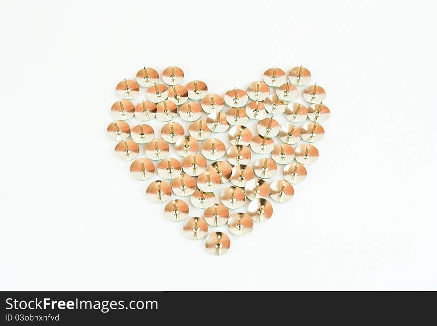 Heart made of thumbtack. fake