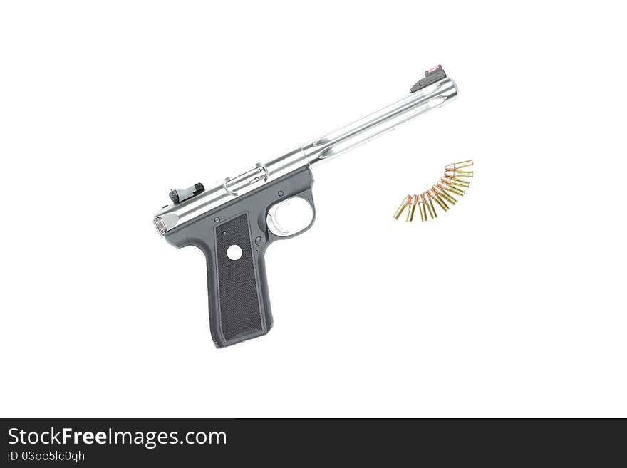 A pistol and ammunition against a white background. A pistol and ammunition against a white background