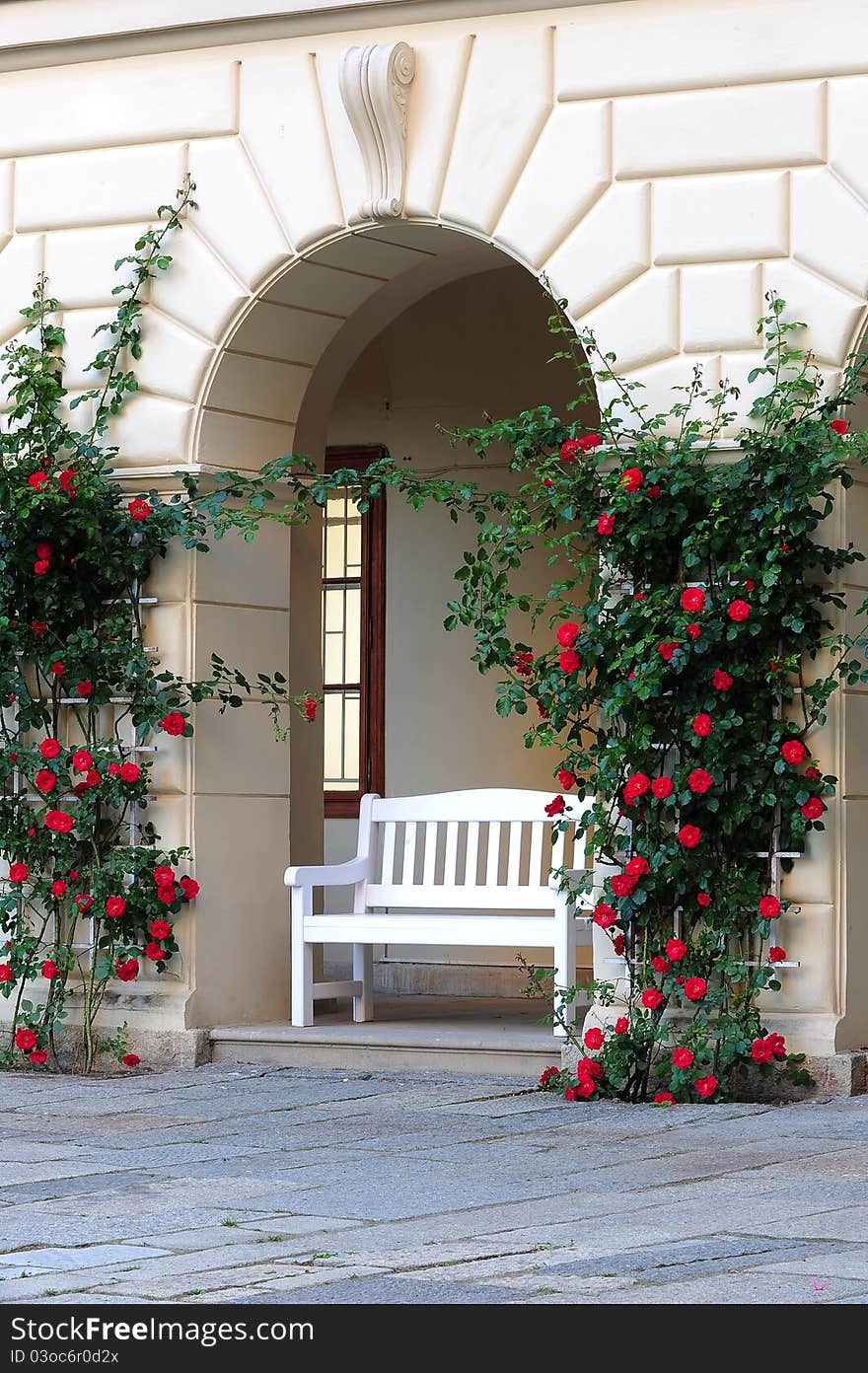 White bench under the arc wall