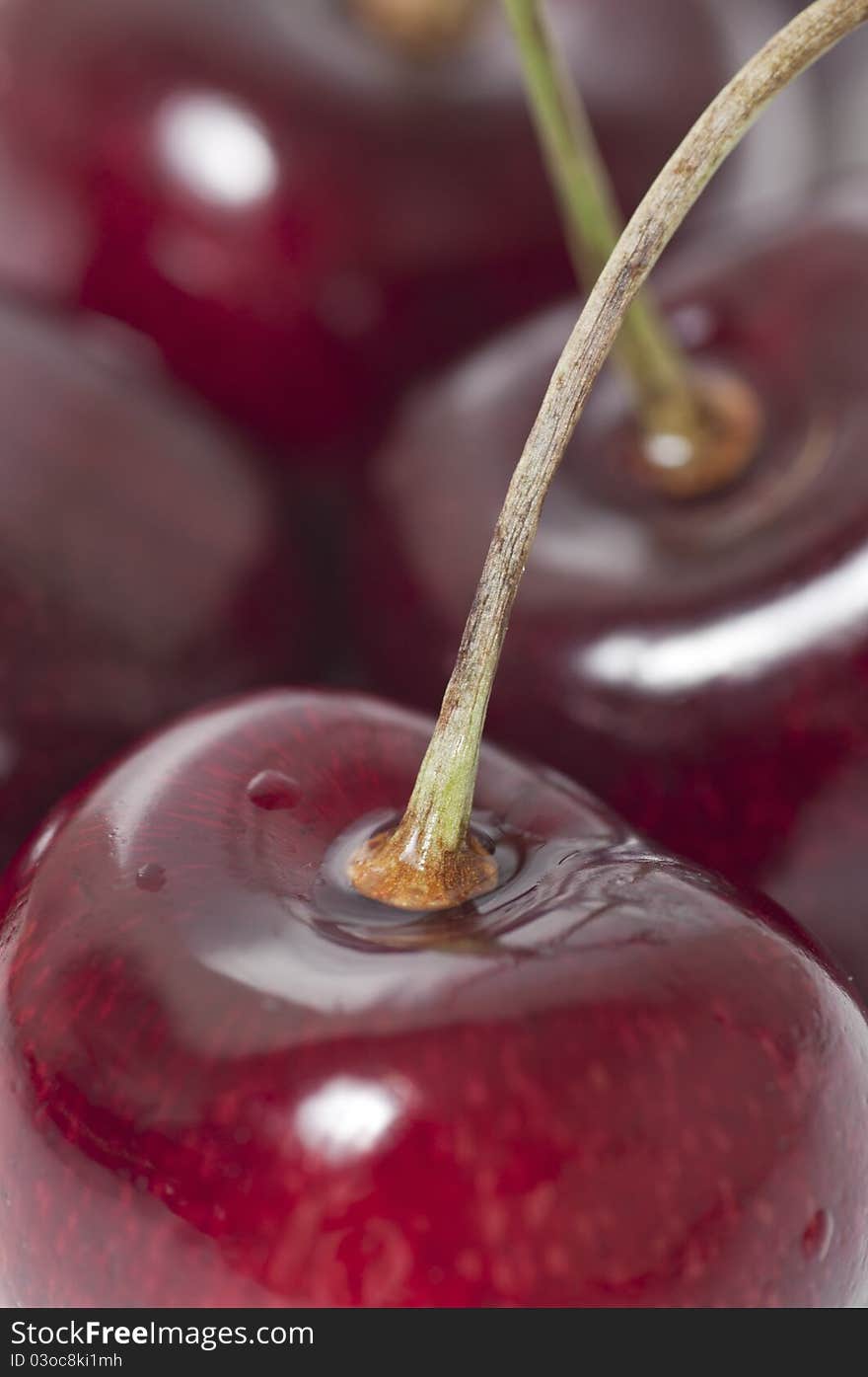 Macro fresh cherry and water drop