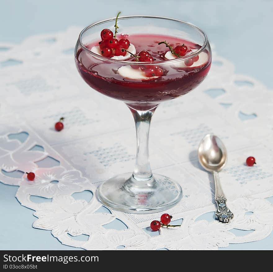 Red currant preserve in glass at white background. Red currant preserve in glass at white background