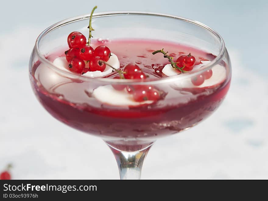 Red currant preserve in glass at white background. Red currant preserve in glass at white background