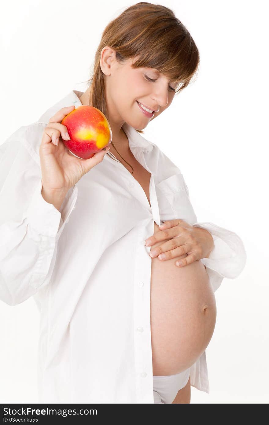 Pregnant woman holding an apple. Pregnant woman holding an apple