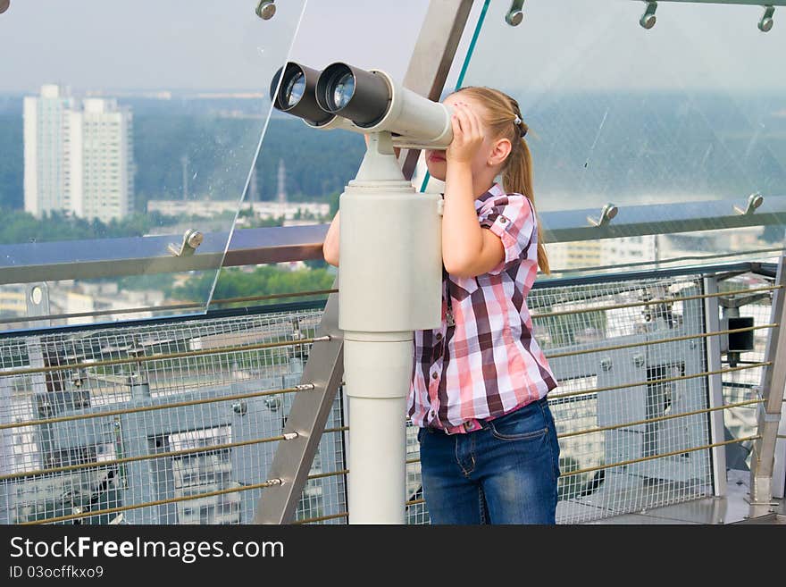 A Girl Looks Through A Telescope