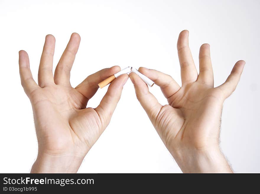 Man S Hands Breaking A Cigarette