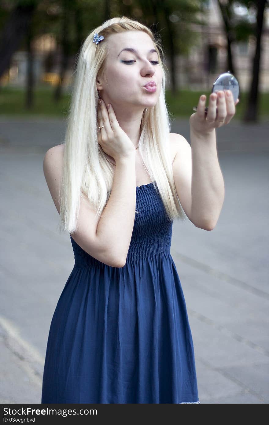 Portrait of young woman in small mirror. Portrait of young woman in small mirror