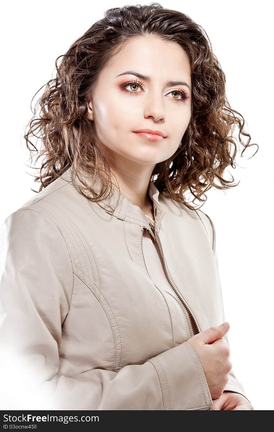 Studio portrait of a young girl with curly hair and bright makeup isolated on white. Studio portrait of a young girl with curly hair and bright makeup isolated on white